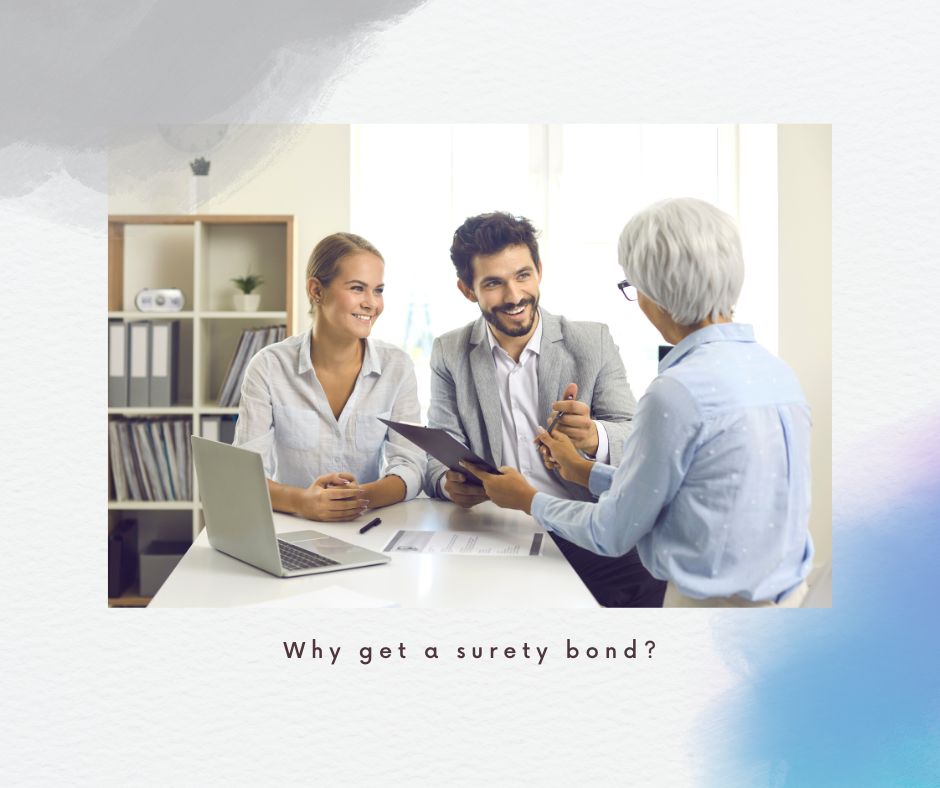 Why get a surety bond? - A surety agent is talking to business couple about their bond's need on a white table.